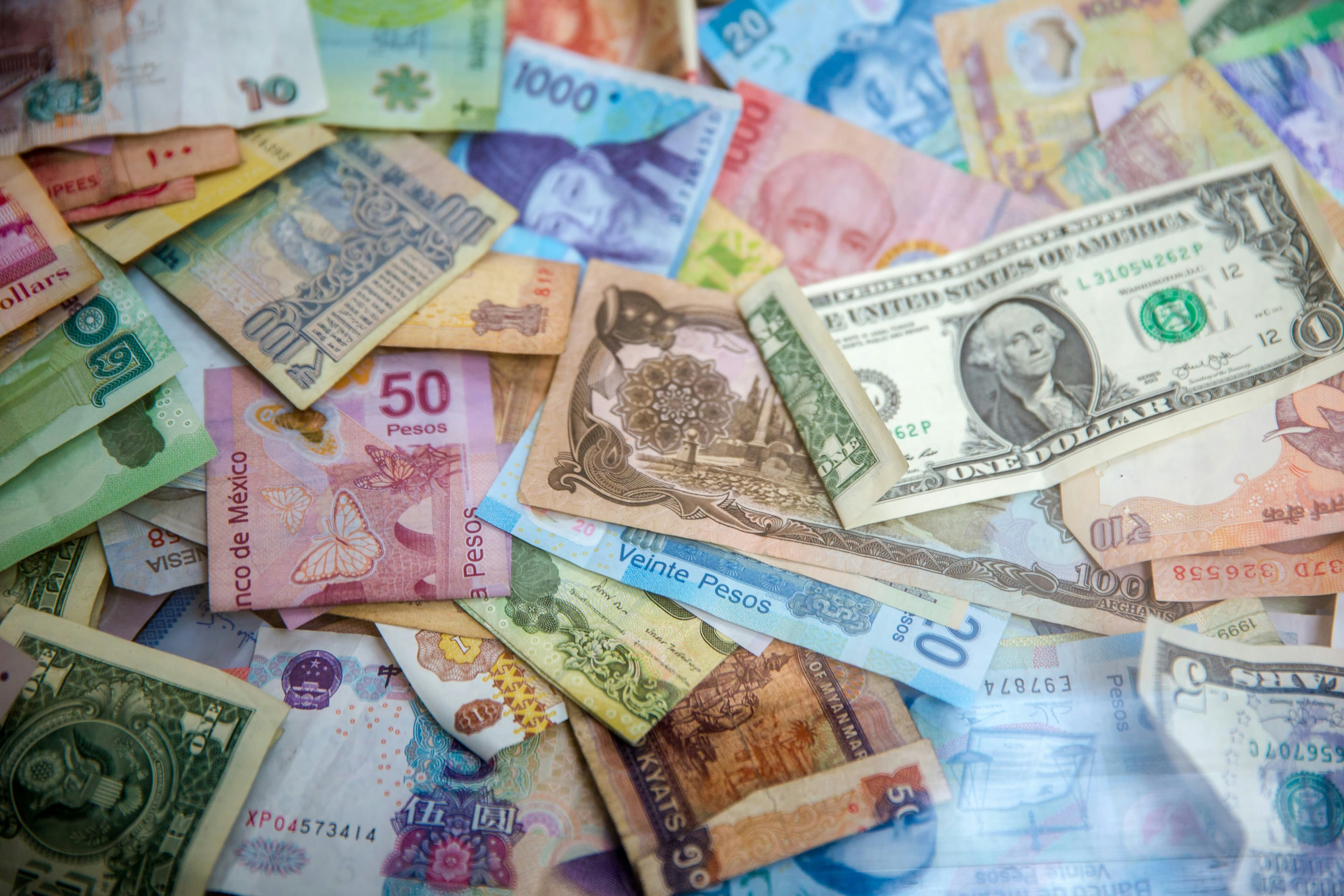 Banknotes from several countries laid out together
