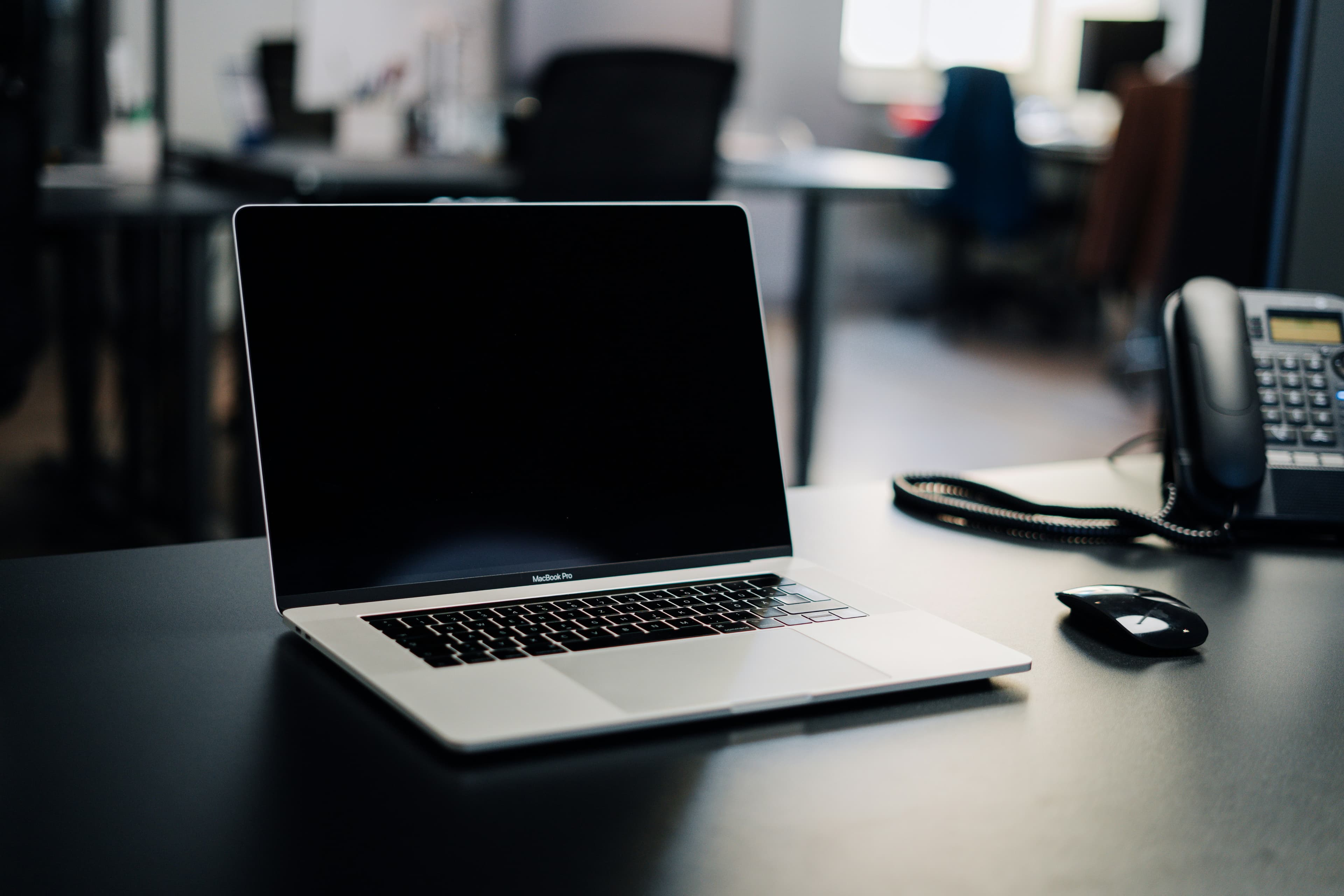 Laptop and phone on a tidy desk